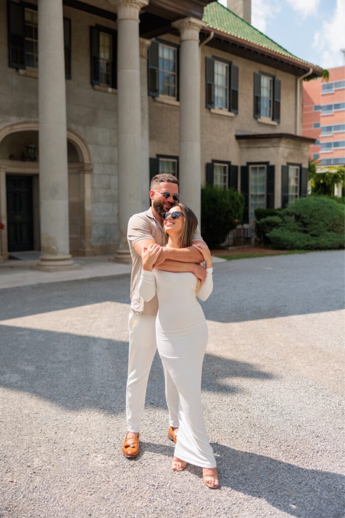 Intimate photo of a groom holding and hugging his bride