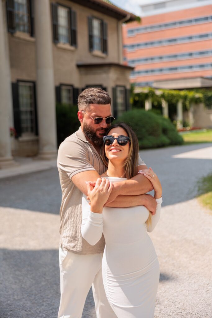 Photo of a couple wearing sunglasses for their engagement shoot