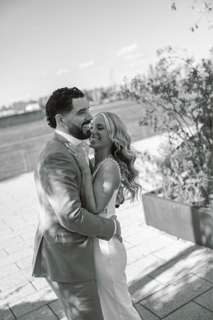 Candid engagement photo of couple laughing